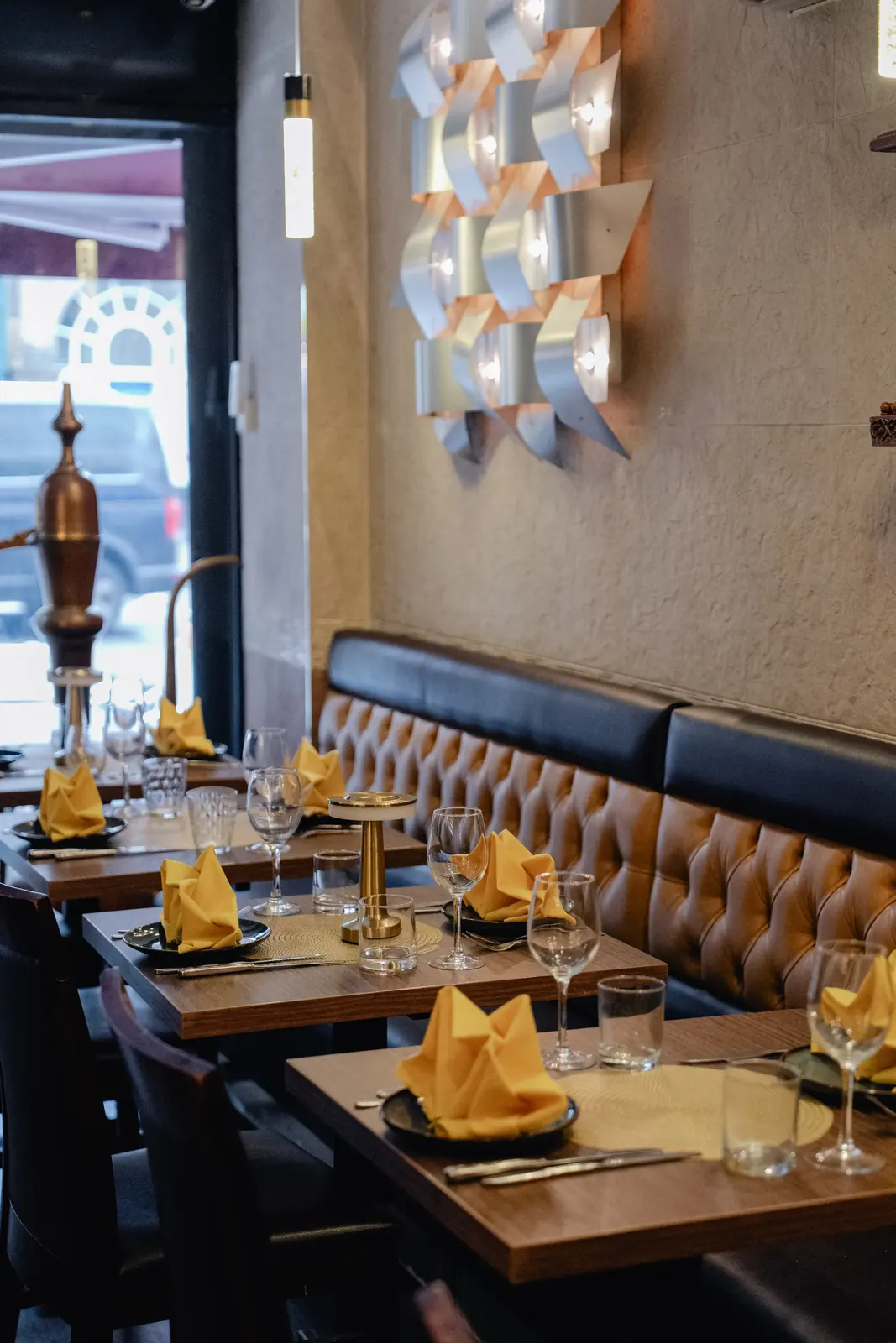 A corner table by the window at Maharaja of India Soho