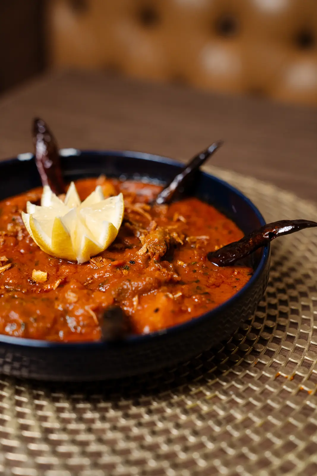 Lamb rogan josh in a black karahi with Kashmiri chillies